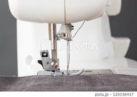 Sewing machine, stitching fabrics, needle in a round plan Sewing machine, stitching fabrics, needle in a round plan 120336437