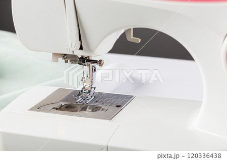 Sewing machine, stitching fabrics, needle in a round plan 120336438