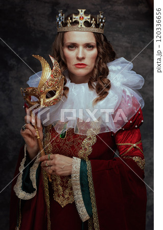 medieval queen in red dress with venetian mask medieval queen in red dress with venetian mask 120336656