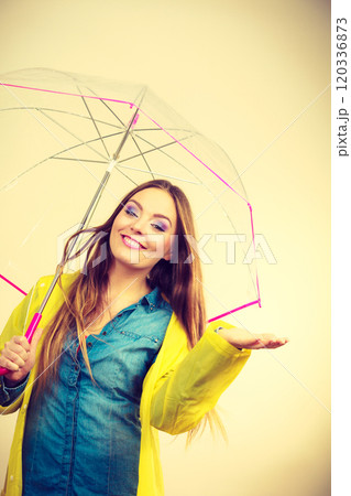 Woman in rainproof coat with umbrella. Forecasting Woman in rainproof coat with umbrella. Forecasting 120336873