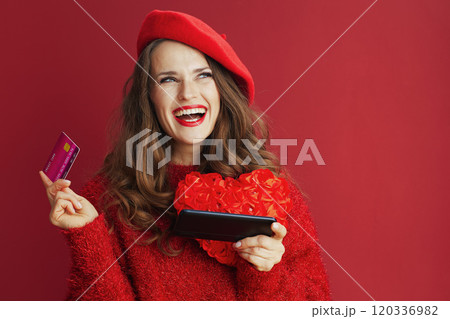 happy stylish woman in red sweater and beret shop online 120336982