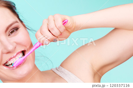 Woman brushing cleaning teeth 120337116