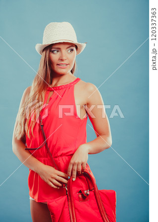 Fashion woman in hat and red shirt with handbag. Fashion woman in hat and red shirt with handbag. 120337363
