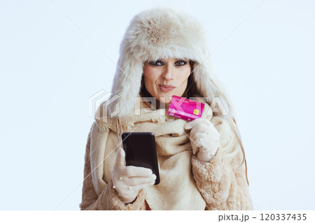 doubting stylish woman using smartphone on white 120337435