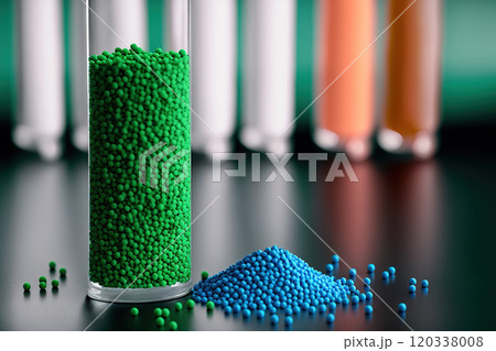 Green Biodegradable plastic granules in test tubes 120338008