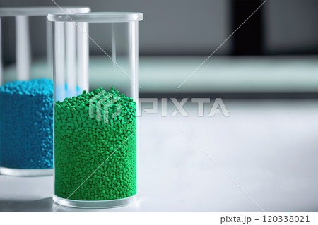 Green eco-friendly plastic granules in test tubes 120338021