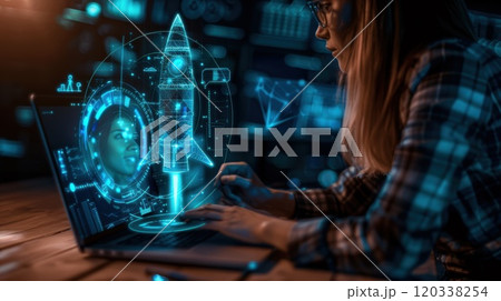 A laptop on a desk showing a hologram of a rocket symbolizing innovation . High quality illustration 120338254