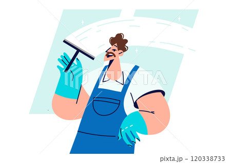 Man window cleaner cleans glass, polishing surface and removing traces of streaks and stains 120338733