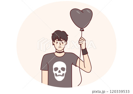 Guy teenager in goth clothes holds black balloon in form of heart for girl he likes from school Guy teenager in goth clothes holds black balloon in form of heart for girl he likes from school 120339533