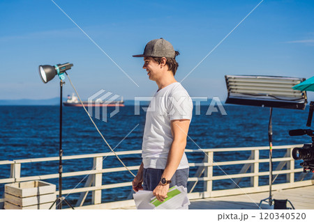 Director on a musical clip production set working with a mood of the group 120340520