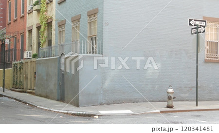 New York City oneway crossroad, Minetta street intersection, one way road sign. Manhattan, Greenwich 120341481