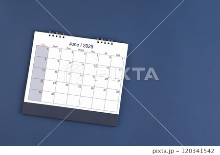 June 2025 Monthly desk calendar for 2025 year on blue color background, Position with copy space. June 2025 Monthly desk calendar for 2025 year on blue color background, Position with copy space. 120341542