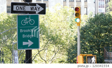 Bike lane road sign, New York City. Brooklyn Bridge bicycle path, cycle route in Manhattan downtown. Bike lane road sign, New York City. Brooklyn Bridge bicycle path, cycle route in Manhattan downtown. 120341554
