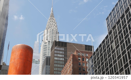 Steam vapor vented, New York City street steam system, orange vapour tube stack. Hot smoke from pipe Steam vapor vented, New York City street steam system, orange vapour tube stack. Hot smoke from pipe 120341957