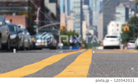 New York City skyline, Manhattan cityscape. Dividing line in Queens, Long Island street road, USA. 120342011