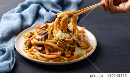 Yaki Udon, Stir fried udon noodles with tofu, carrot, cabbage and mushroom Yaki Udon, Stir fried udon noodles with tofu, carrot, cabbage and mushroom 120343856