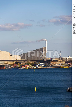 Amager Bakke in Copenhagen, Denmark, known as Amager Slope or Copenhill, combined heat and power waste to energy plant with recreational facility Amager Bakke in Copenhagen, Denmark, known as Amager Slope or Copenhill, combined heat and power waste to energy plant with recreational facility 120344173