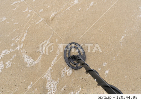 Metal Detector Search Coil Scanning Beach Sand, Treasure Hunt, Lost Jewels, Copy Space for Text 120344398