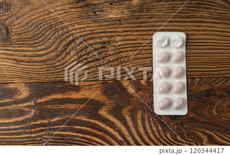 Pill Blister on Wooden Background, Silver Capsule Package Mockup, Drugs Packaging Banner, Pill Pack Pill Blister on Wooden Background, Silver Capsule Package Mockup, Drugs Packaging Banner, Pill Pack 120344417