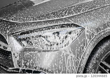 car cleaning and washing with foam soap 120344885