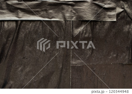 Black crumpled and creased paper poster grunge texture background 120344948