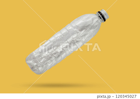 recycled plastic bottle isolated on yellow background recycled plastic bottle isolated on yellow background 120345027