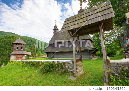 likitsary, transcarpathia, ukraine - jul 02, 2020: st. vasyl wooden church in carpathian mountains. amazing architecture landmark. sunny summer day 120345862