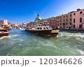 A large public transportation vaporetto near Ferrovia stop, moves along the Grand Canal in Venice 120346626