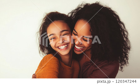 Portrait of a smiling mother and teenage daughter for family lifestyle imagery 120347244