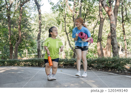 Empowering Friendship Disabled Young Woman Jogging with Close Friend in Park, Embracing Fitness and Togetherness Empowering Friendship Disabled Young Woman Jogging with Close Friend in Park, Embracing Fitness and Togetherness 120349140
