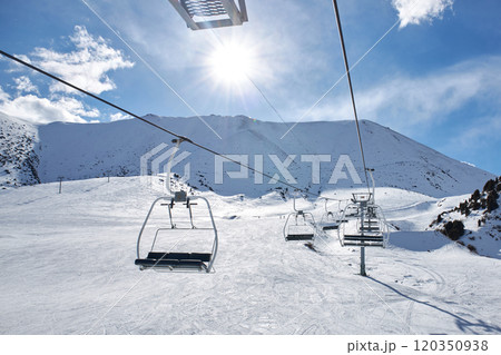 Skilift construction. Empty cable car on mountain slope at ski resort. Winter 120350938
