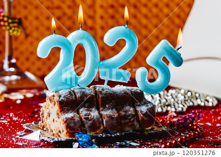 candles forming number 2025 on a cake candles forming number 2025 on a cake 120351276