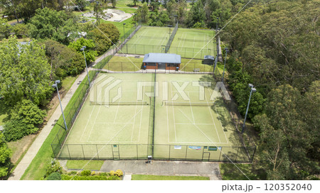 A local community tennis club with multiple courts A local community tennis club with multiple courts 120352040