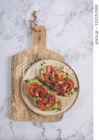 sandwiches with avocado and caramelized shrimp, micro-greens, breakfast, on a plate, top view, homemade, no people, 120352988