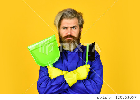 Gardener cleaning service man. Cleaning agency. Worker with brush. Cleaning equipment. Yardman occupation. Garbage removal. Cleaning day. Janitor professional. Bearded hipster blue uniform with broom 120353057