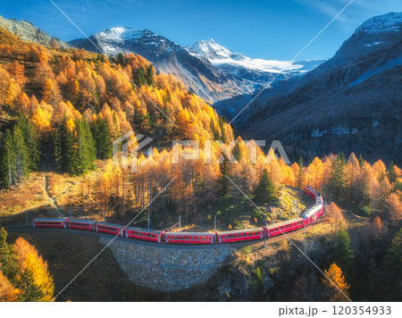 Bernina express train is moving along the swiss alps in autumn Bernina express train is moving along the swiss alps in autumn 120354933