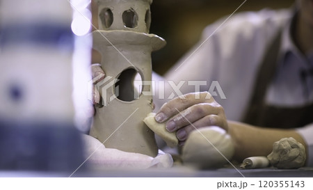 Handcrafted Clay Sculpture is currently in progress and being carefully created by the artist. Stock Clip 120355143