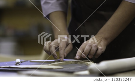 Engaging in Artisan Crafting with Dough A Detailed and Creative Culinary Process. Stock Clip 120355247