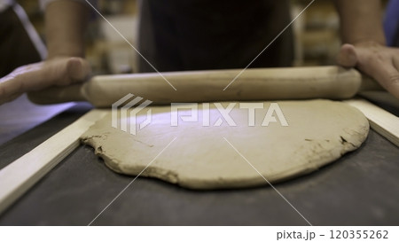 Hands Skillfully Working with Clay during an Engaging Pottery Class Experience in a Studio. Stock Clip Hands Skillfully Working with Clay during an Engaging Pottery Class Experience in a Studio. Stock Clip 120355262