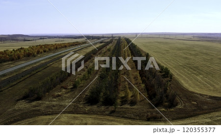 This is an Aerial View showcasing the Highway and the beautiful Countryside Landscape below. Stock Clip 120355377
