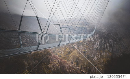 View of the Ponte 516 Arouca bridge in Portugal. The highest bridge in Europe - the bridge near Arouca in Portugal in cloudy weather View of the Ponte 516 Arouca bridge in Portugal. The highest bridge in Europe - the bridge near Arouca in Portugal in cloudy weather 120355474