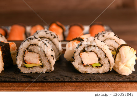 Japanese sushi food, Maki ands rolls with tuna, salmon, shrimp, crab and avocado 120355845