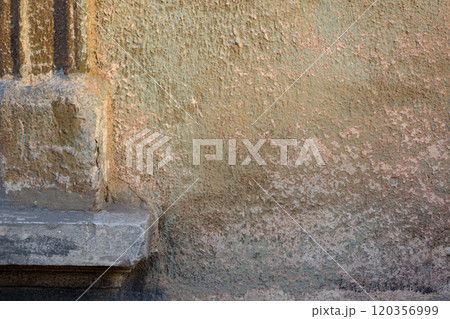 Corner of a window with cement edging and peeling wall with green and carmine stains Corner of a window with cement edging and peeling wall with green and carmine stains 120356999