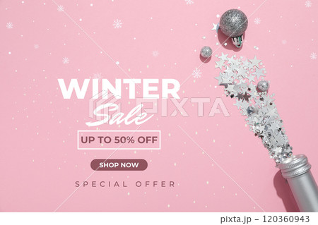 Winter sale, bottle of champagne, confetti and Christmas balls on a pink background with text Winter sale, bottle of champagne, confetti and Christmas balls on a pink background with text 120360943