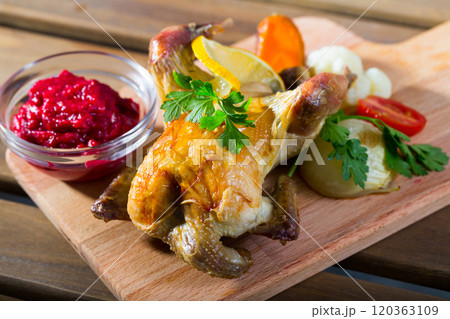 Roasted partridge with cranberry sauce 120363109