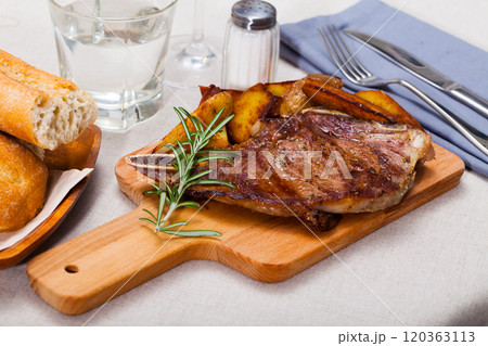 Beef steak with potatoes on a wooden board Beef steak with potatoes on a wooden board 120363113