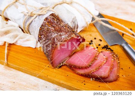 Sliced cured sirloin pork on wooden cuting board Sliced cured sirloin pork on wooden cuting board 120363120