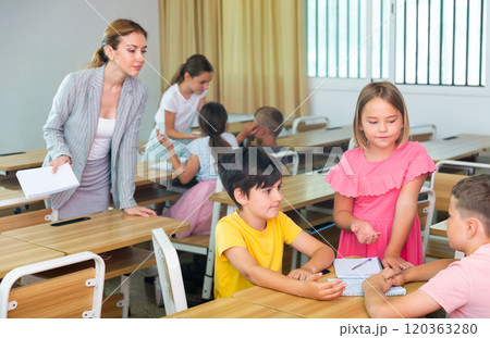 Preteen schoolchilds working in groups at lesson Preteen schoolchilds working in groups at lesson 120363280