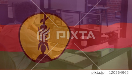 Person working on laptop in office over flag image with emblem Person working on laptop in office over flag image with emblem 120364963