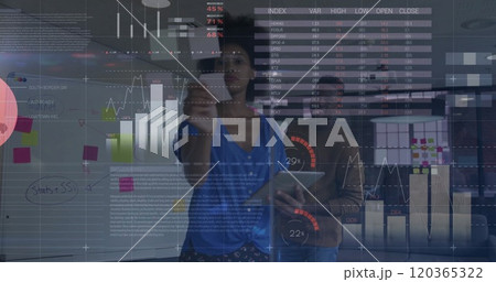 Image of financial data processing over diverse business people in office Image of financial data processing over diverse business people in office 120365322
